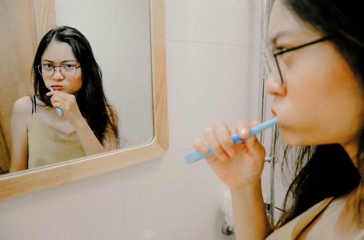 Woman brushing her teeth